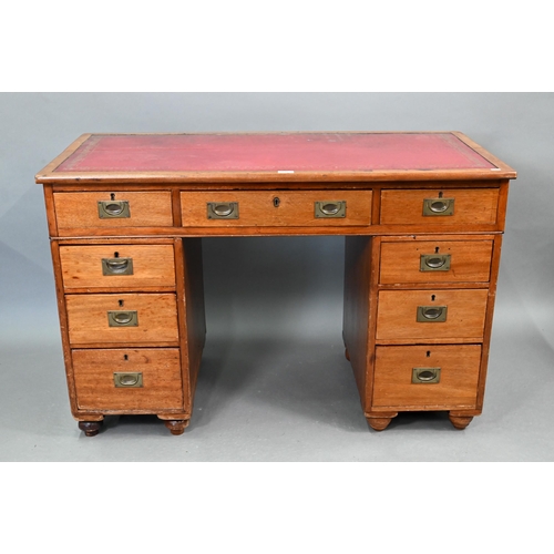 679 - A Victorian style mahogany twin pedestal desk, the top with gilt tooled red leather surface over an ... 