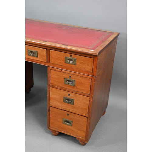 679 - A Victorian style mahogany twin pedestal desk, the top with gilt tooled red leather surface over an ... 