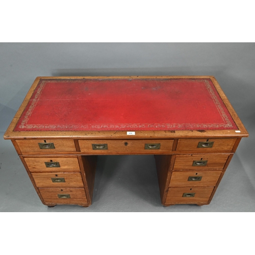 679 - A Victorian style mahogany twin pedestal desk, the top with gilt tooled red leather surface over an ... 