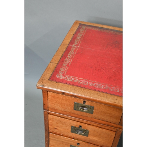 679 - A Victorian style mahogany twin pedestal desk, the top with gilt tooled red leather surface over an ... 