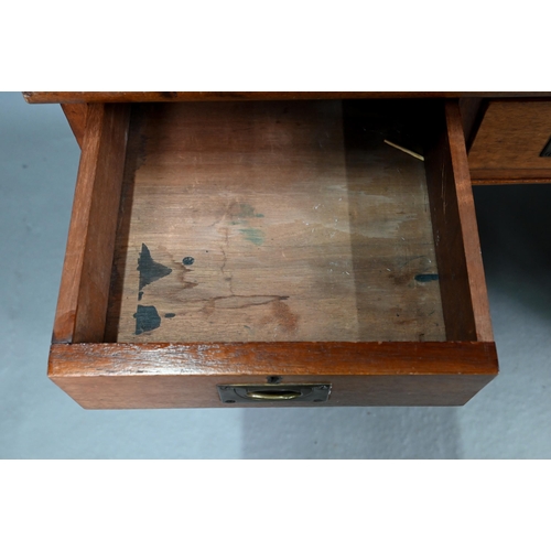 679 - A Victorian style mahogany twin pedestal desk, the top with gilt tooled red leather surface over an ... 