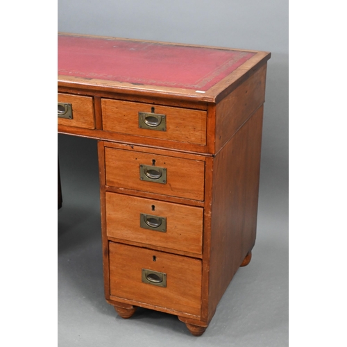 679 - A Victorian style mahogany twin pedestal desk, the top with gilt tooled red leather surface over an ... 