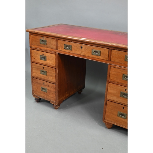 679 - A Victorian style mahogany twin pedestal desk, the top with gilt tooled red leather surface over an ... 