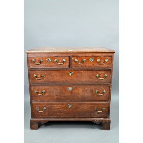 680 - An 18th century oak chest of two short over three long graduated cock-beaded drawers, with brass fit... 