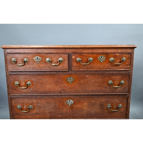 680 - An 18th century oak chest of two short over three long graduated cock-beaded drawers, with brass fit... 