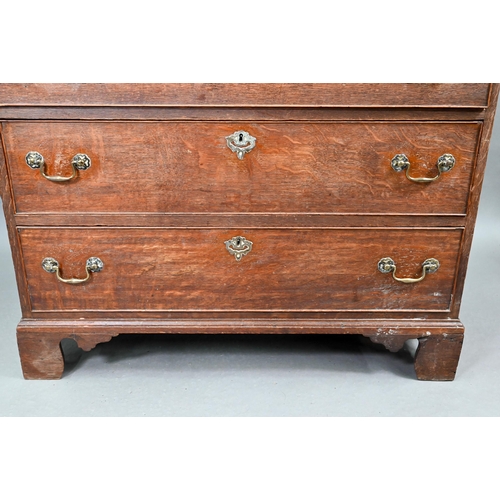 680 - An 18th century oak chest of two short over three long graduated cock-beaded drawers, with brass fit... 