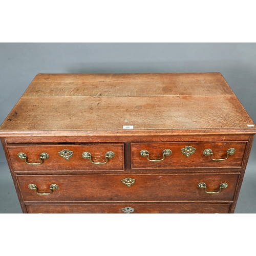 680 - An 18th century oak chest of two short over three long graduated cock-beaded drawers, with brass fit... 