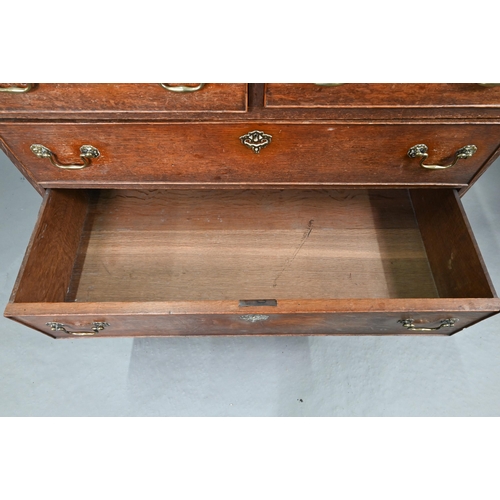 680 - An 18th century oak chest of two short over three long graduated cock-beaded drawers, with brass fit... 