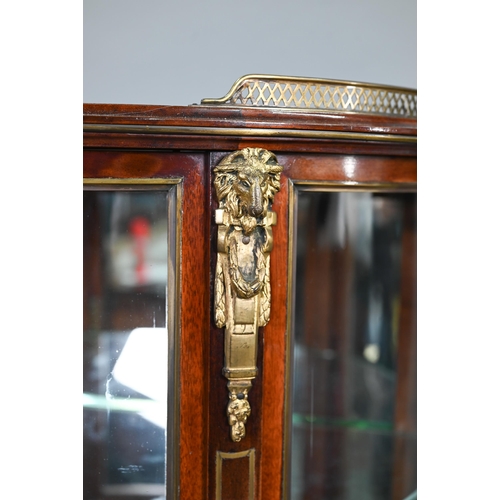 686 - A good late 19th century brass inlaid and mounted red walnut demi-lune salon vitrine cabinet, the pi... 