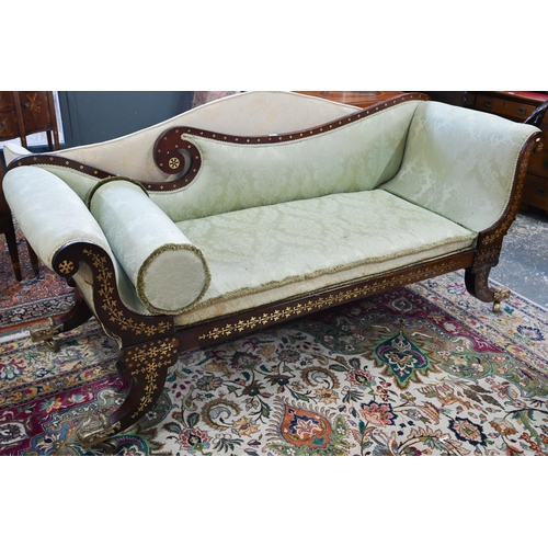 688 - A Regency profusely brass inlaid rosewood scroll end sofa, with pale green damask upholstery and rai... 