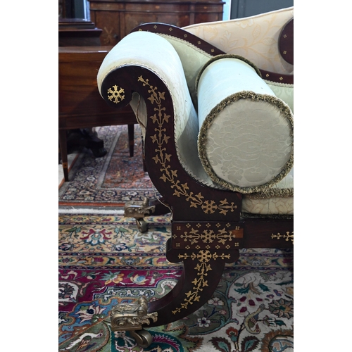 688 - A Regency profusely brass inlaid rosewood scroll end sofa, with pale green damask upholstery and rai... 