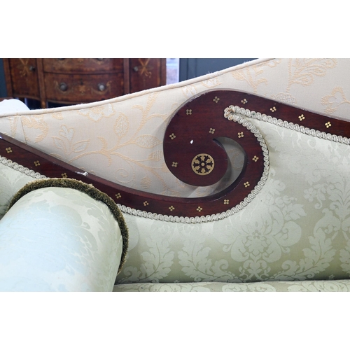 688 - A Regency profusely brass inlaid rosewood scroll end sofa, with pale green damask upholstery and rai... 