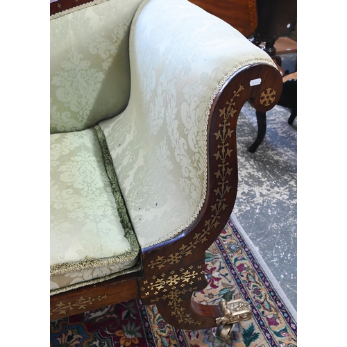 688 - A Regency profusely brass inlaid rosewood scroll end sofa, with pale green damask upholstery and rai... 