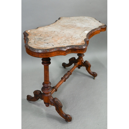 693 - A Victorian inlaid walnut centre table, the shaped and figured veneered top over turned and moulded ... 