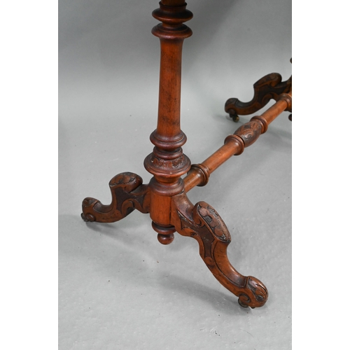 693 - A Victorian inlaid walnut centre table, the shaped and figured veneered top over turned and moulded ... 