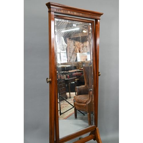 702 - An Edwardian red walnut framed cheval dressing mirror, with rectangular bevelled plate, raised on br... 