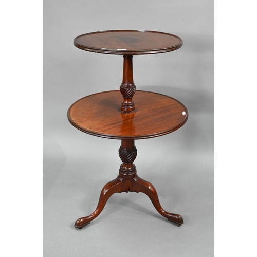 704 - A Victorian mahogany two graduated dumb waiter, on tripod base, 60 cm dia. x 98 cm h