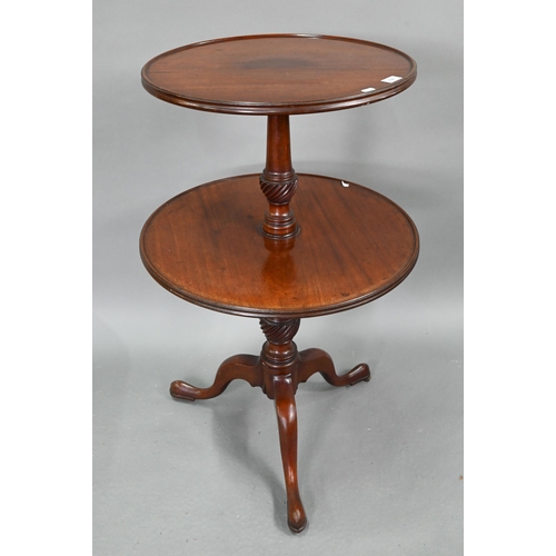 704 - A Victorian mahogany two graduated dumb waiter, on tripod base, 60 cm dia. x 98 cm h