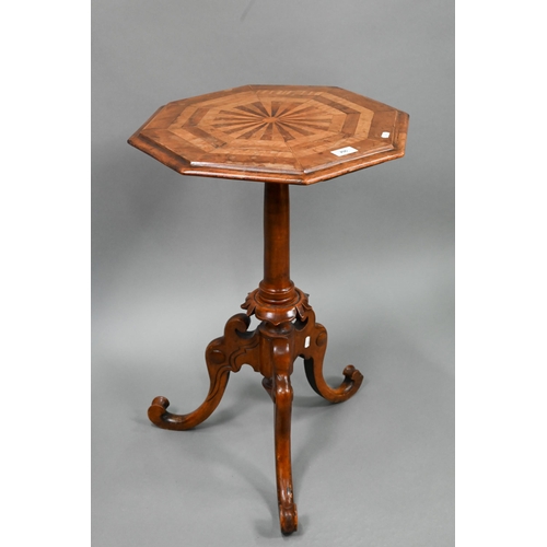 706 - A Victorian radially veneered octagonal top tripod table, 45 cm dia. x 69 cm h