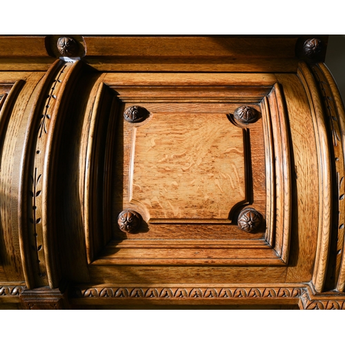 707 - An antique American Wells Fargo 'Wooton' style desk, golden oak, the hinged upper panel over a pair ... 