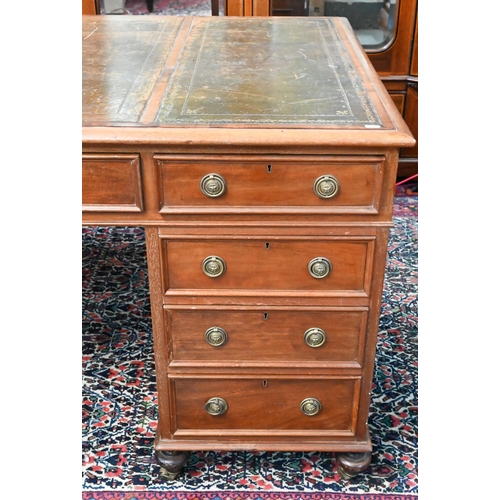 714 - A traditional red walnut twin pedestal partners desk, the triple green leather panelled top over an ... 