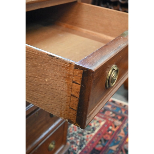 714 - A traditional red walnut twin pedestal partners desk, the triple green leather panelled top over an ... 