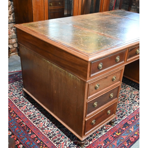 714 - A traditional red walnut twin pedestal partners desk, the triple green leather panelled top over an ... 