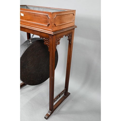 715 - An early 20th century Chippendale Revival walnut gong stand, with heavy patinated brass gong, to/wit... 