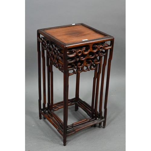 716 - A graduated set of four Chinese stacking hardwood occasional tables, with pierce friezes, circa 1900... 