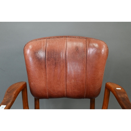 718 - A vintage American brown leather upholstered overstuffed swivel seat office chair by Sikes, on brass... 