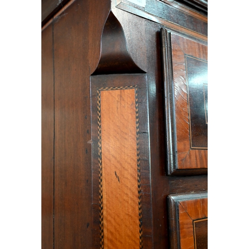 719 - A Victorian cross banded and inlaid bright mahogany chest on chest, the dentil moulded cornice over ... 