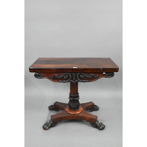 720 - A Regency rosewood card table, the fold over rotating top enclosing a blue baize lined surface, over... 