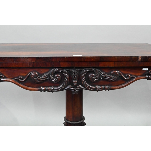 720 - A Regency rosewood card table, the fold over rotating top enclosing a blue baize lined surface, over... 