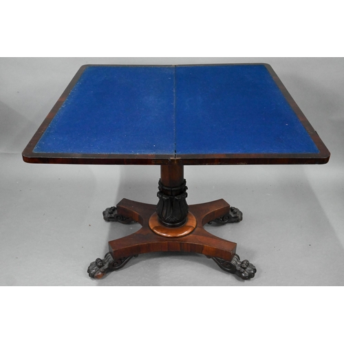 720 - A Regency rosewood card table, the fold over rotating top enclosing a blue baize lined surface, over... 