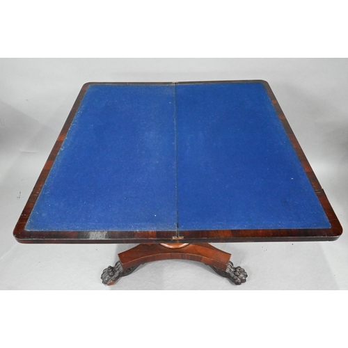 720 - A Regency rosewood card table, the fold over rotating top enclosing a blue baize lined surface, over... 