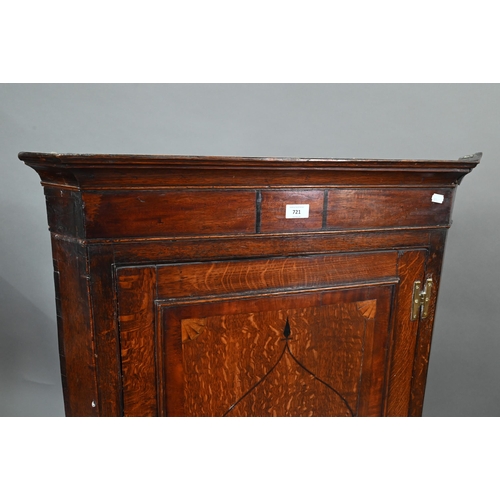 721 - George III inlaid oak hanging corner cupboard, the shell motif inlay door enclosing shaped shelves, ... 