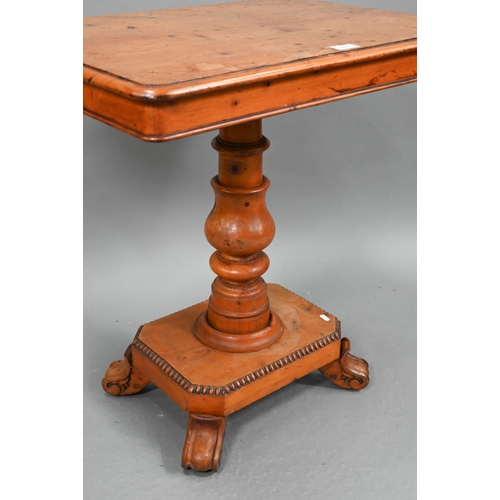 722 - A Victorian yew occasional table, the rectangular tilt top raised on a turned support to a platform ... 