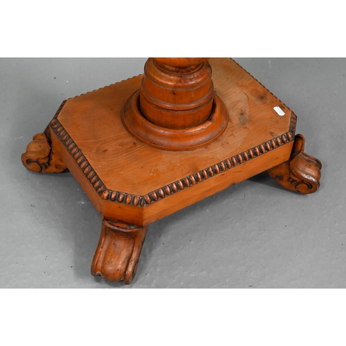 722 - A Victorian yew occasional table, the rectangular tilt top raised on a turned support to a platform ... 