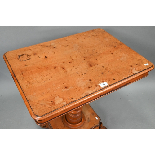 722 - A Victorian yew occasional table, the rectangular tilt top raised on a turned support to a platform ... 