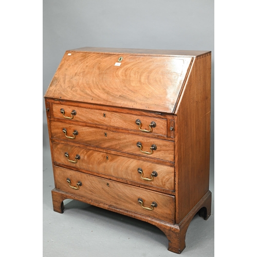 723 - A George III mahogany bureau, with part fitted interior over four long graduated drawers with brass ... 