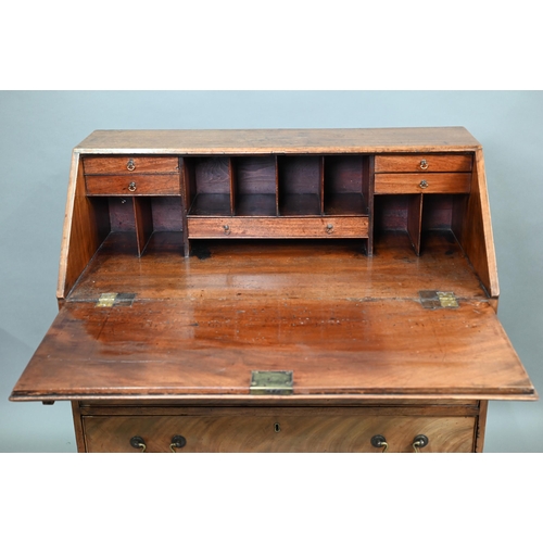 723 - A George III mahogany bureau, with part fitted interior over four long graduated drawers with brass ... 