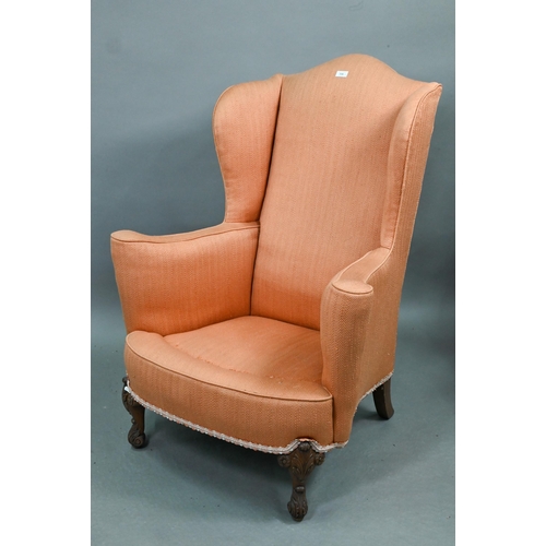 728 - Two similar hump wing-back armchairs with orange upholstery, raised on carved and cabriole front leg... 