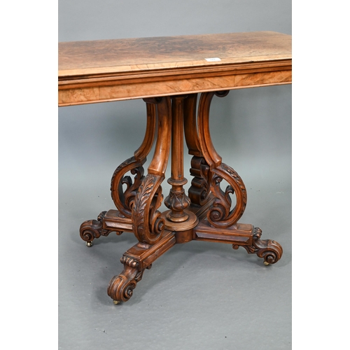 729 - A Victorian figured walnut card table, the rectangular fold over top enclosing a baize lined interio... 