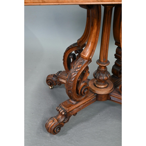 729 - A Victorian figured walnut card table, the rectangular fold over top enclosing a baize lined interio... 