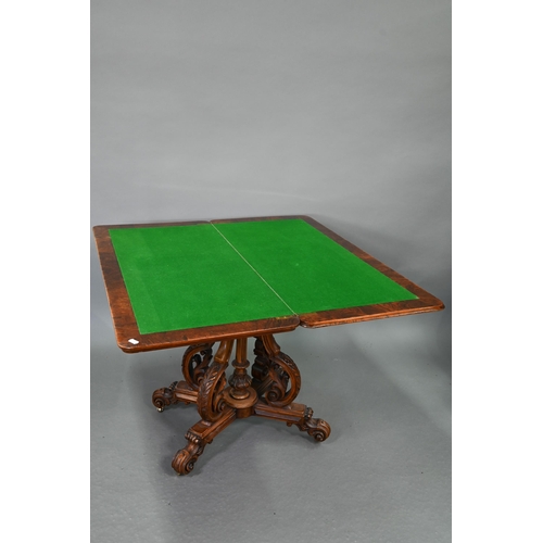 729 - A Victorian figured walnut card table, the rectangular fold over top enclosing a baize lined interio... 