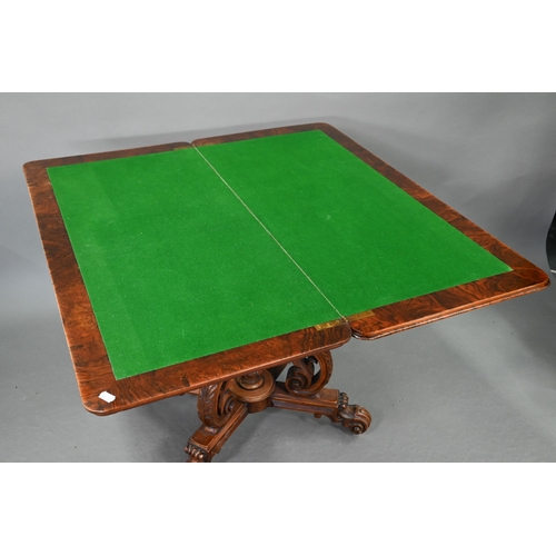 729 - A Victorian figured walnut card table, the rectangular fold over top enclosing a baize lined interio... 