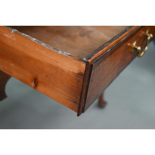 730 - An 18th century oak three drawer lowboy within a shaped apron, raised on cabriole legs to pad feet, ... 