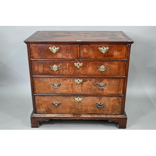 731 - An 18th century feather-banded walnut chest of two short over three long graduated drawers, with bra... 