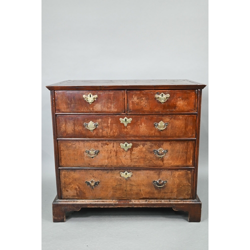 731 - An 18th century feather-banded walnut chest of two short over three long graduated drawers, with bra... 