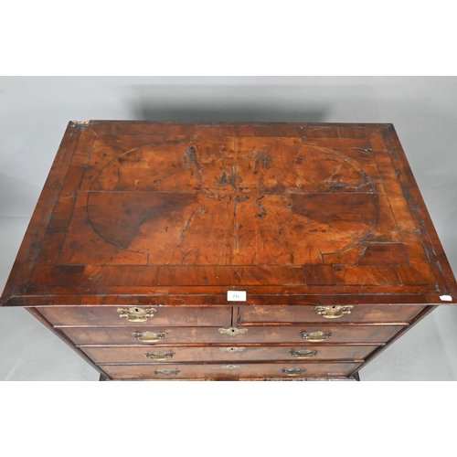 731 - An 18th century feather-banded walnut chest of two short over three long graduated drawers, with bra... 